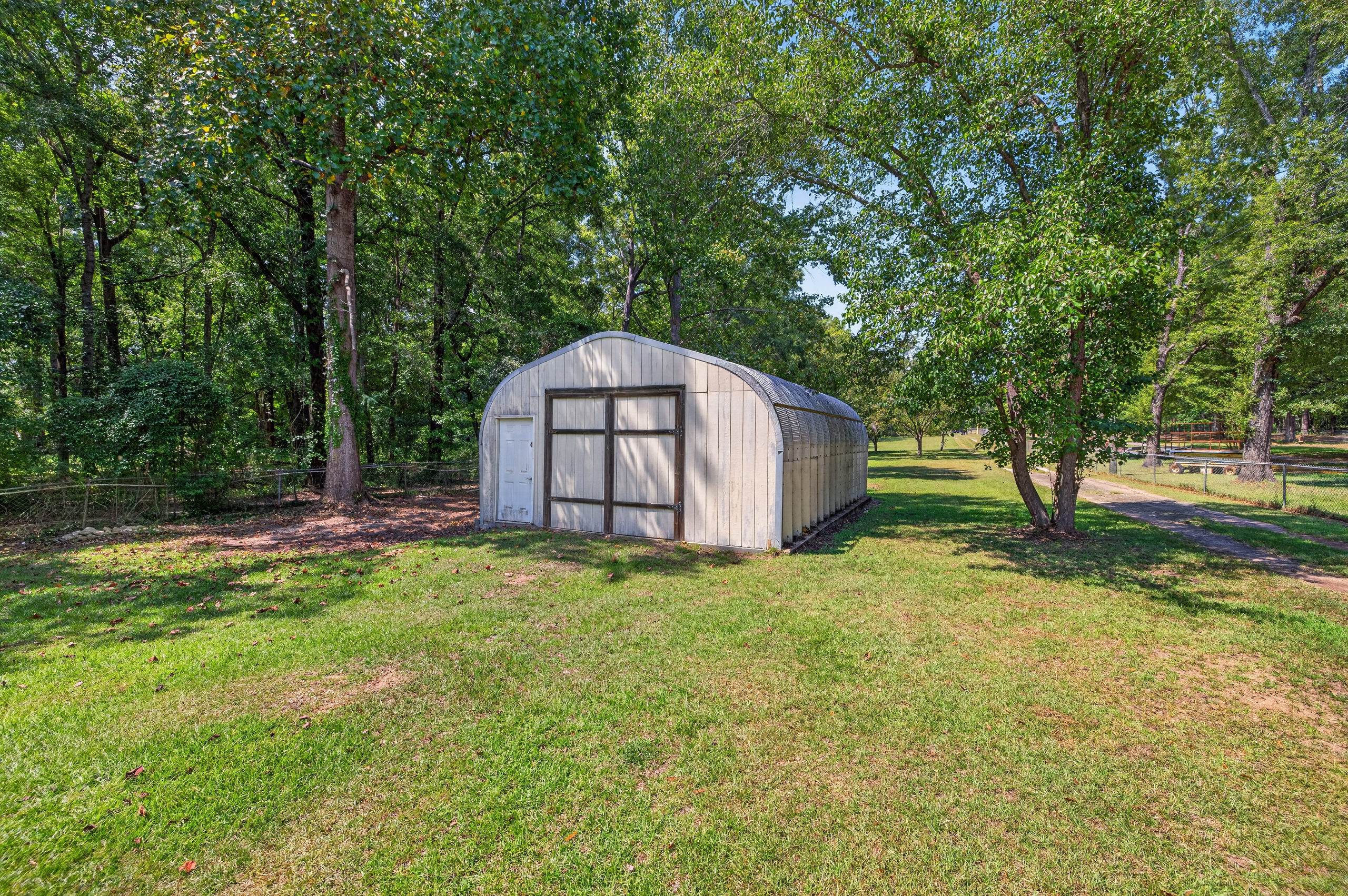 Property grounds and trees on 1.4 flat acres
