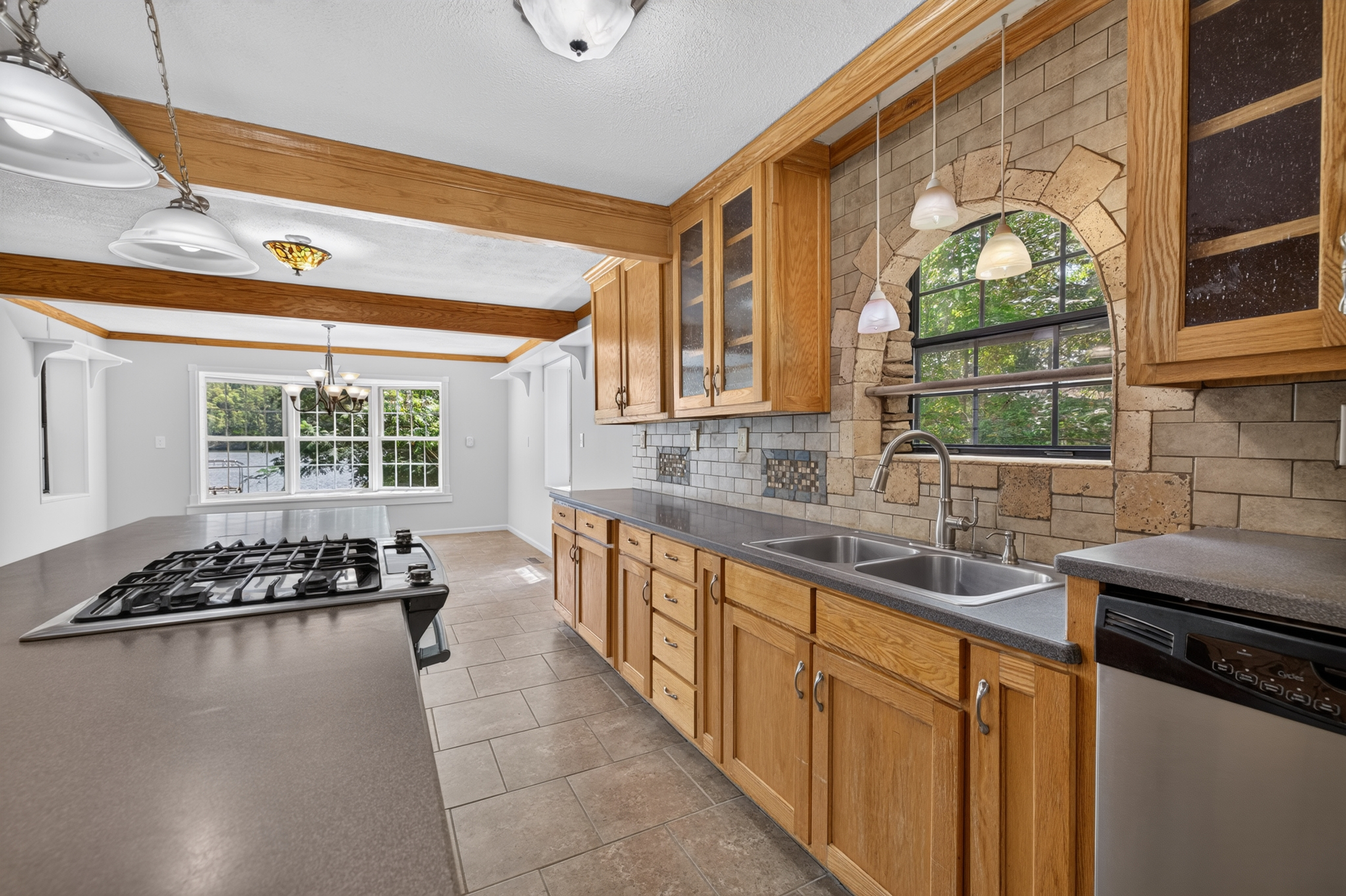 Kitchen sink overlooking lakefront yard