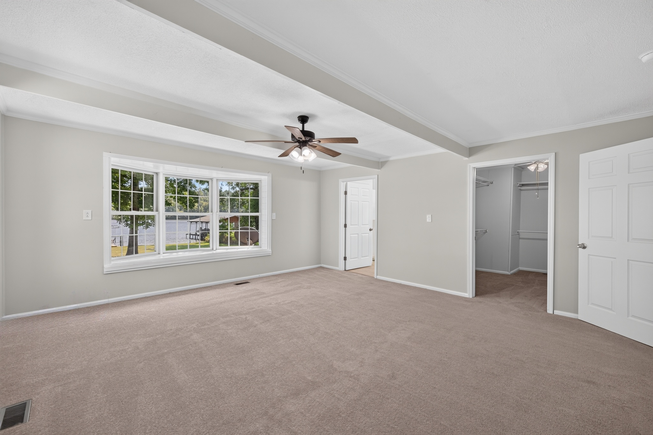 Primary suite with bay window overlooking Lake Sinclair